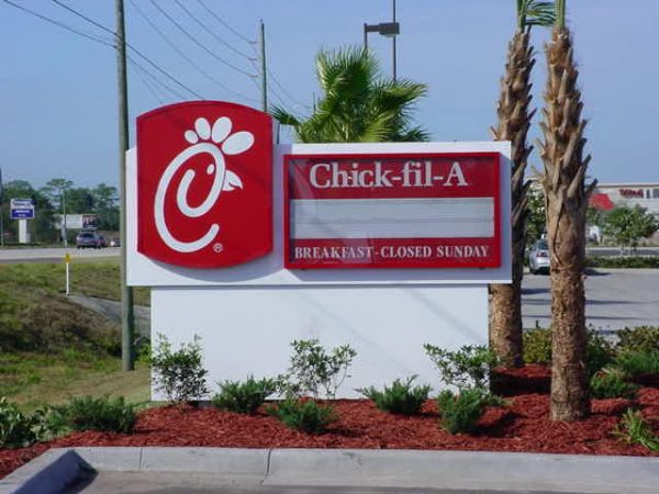 Chick-fil-A branded monument sign with red background and white lettering.