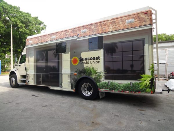 Custom fleet wrap for Suncoast Credit Union vehicle, designed and installed by Thomas Sign to enhance mobile branding