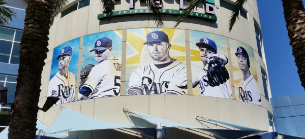 Custom promotional banners for Tropicana Field designed by Thomas Sign, showcasing vibrant team graphics