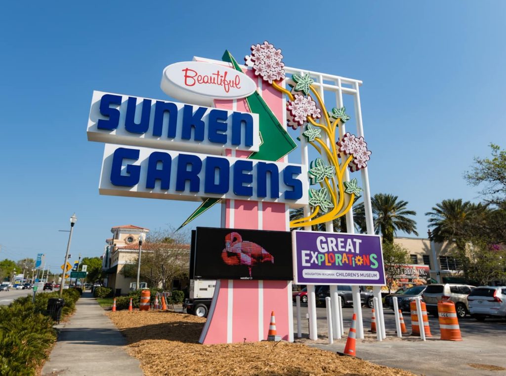 Sunken Gardens custom signage crafted and installed by Thomas Sign & Awning, showcasing vibrant colors and intricate design elements.