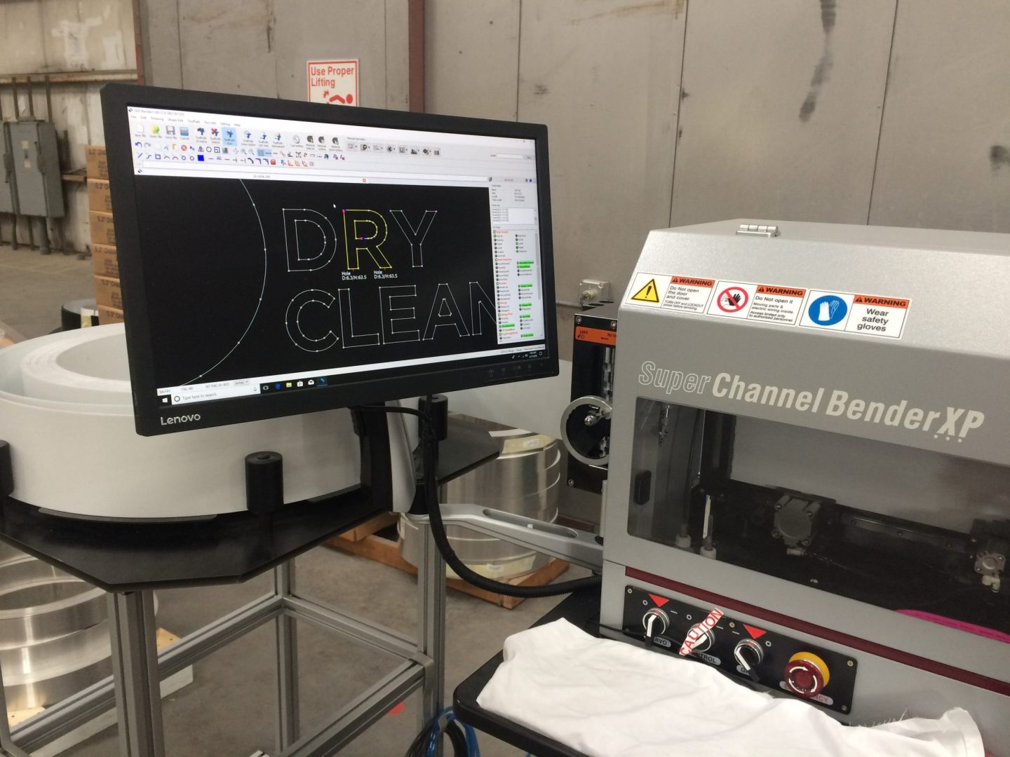 Automated channel letter bending machine used in commercial sign manufacturing process