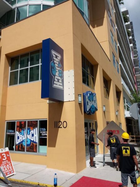 Crunch Fitness franchise blade sign installed by Thomas Sign – corporate-approved vendor signage