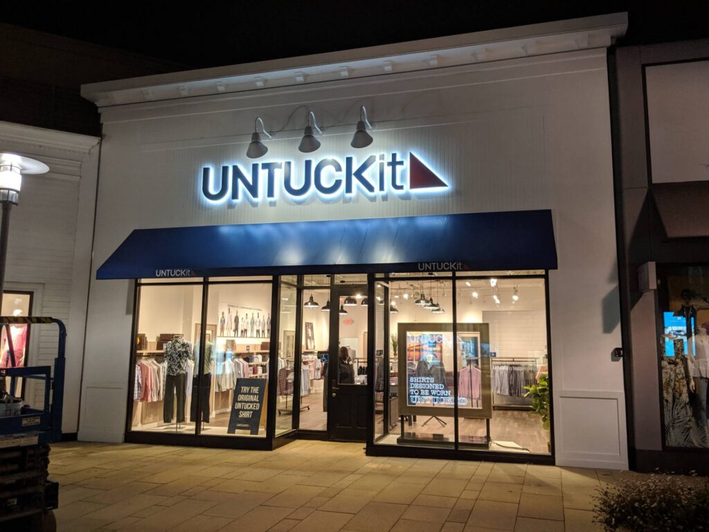 Halo-lit channel letter sign for UNTUCKit retail store fabricated and installed by Thomas Sign & Awning in Corte Madera, California.