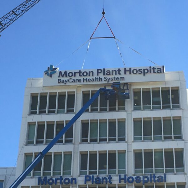 Morton Plant Hospital exterior sign installation with crane lift for BayCare Health System signage