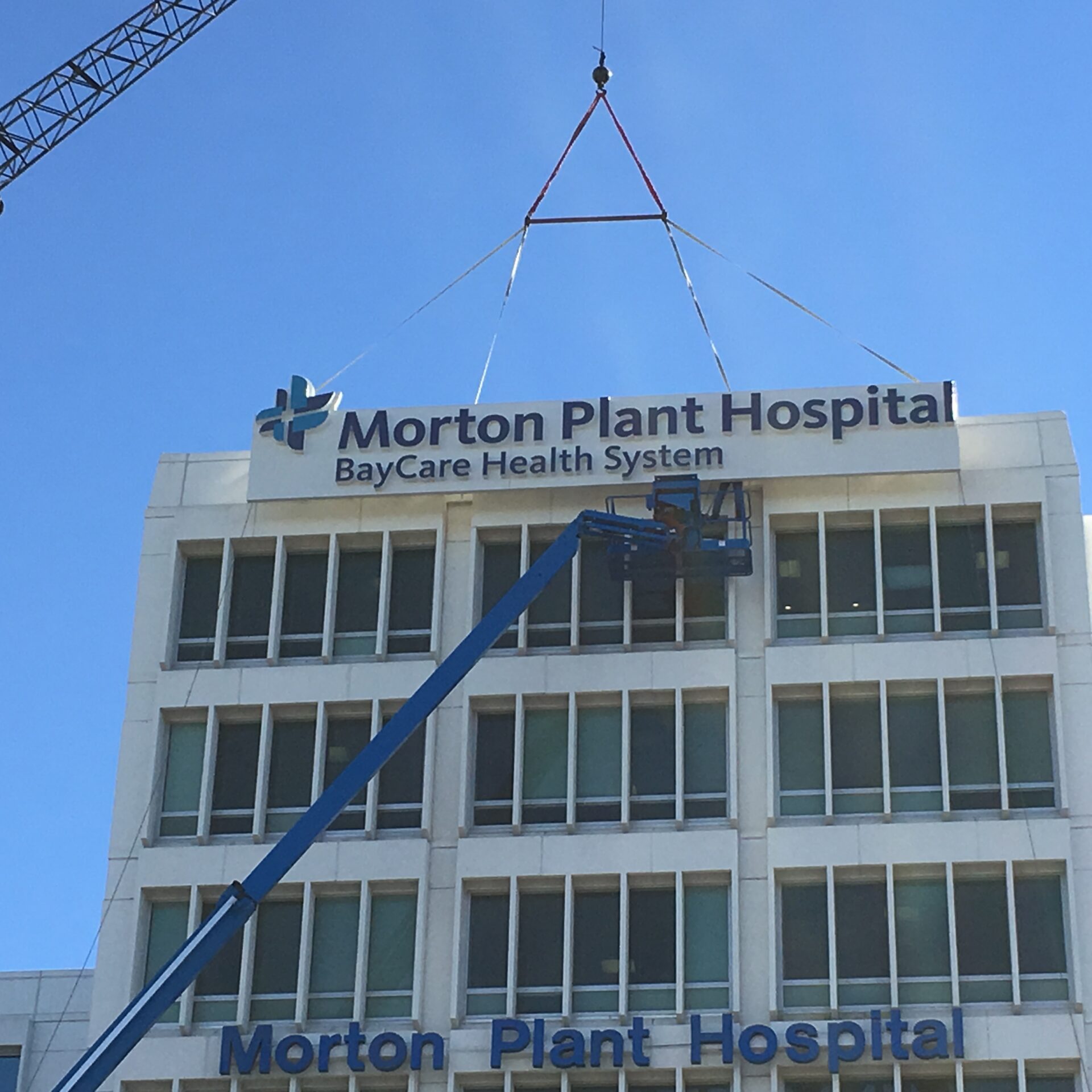 Morton Plant Hospital exterior sign installation with crane lift for BayCare Health System signage
