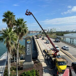 Commercial sign installation using crane truck for large exterior signage