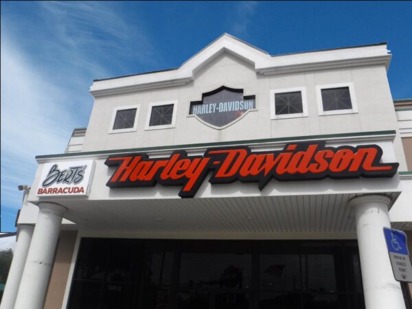 Illuminated Harley-Davidson channel letter wall sign installed on commercial building exterior