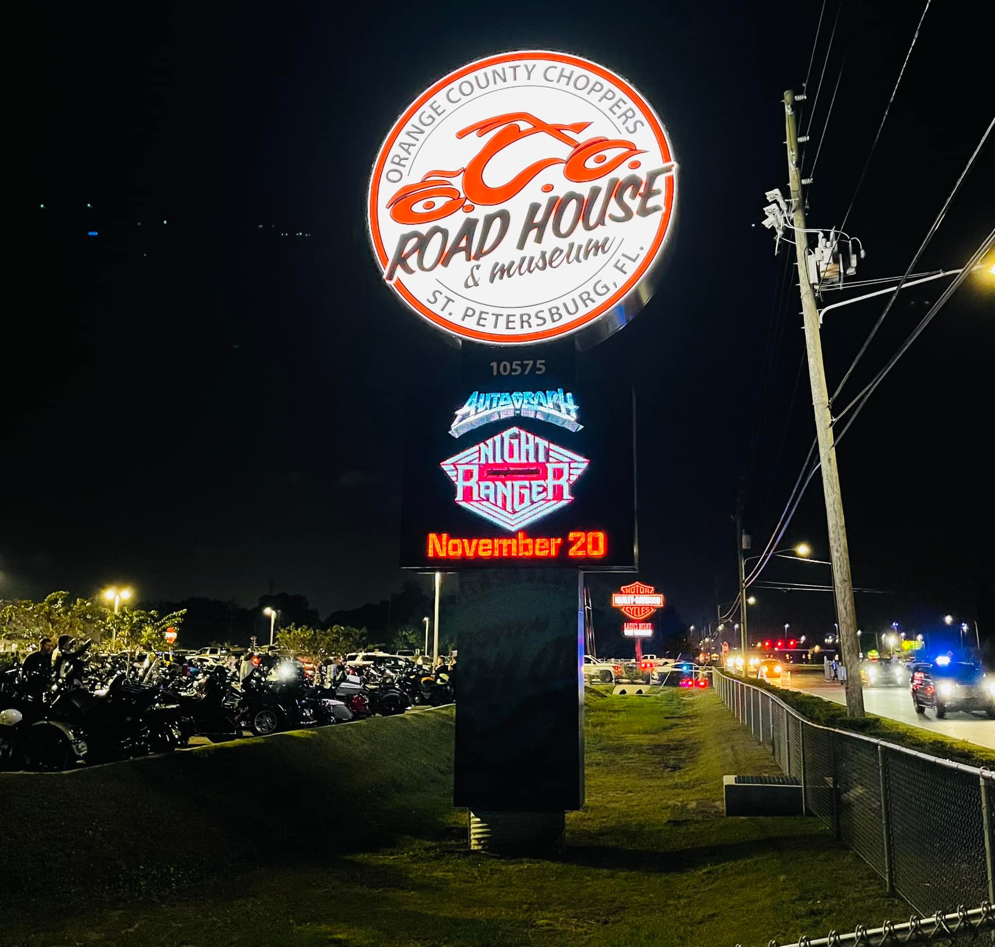 Pylon sign with electronic message center at Orange County Choppers Road House in St Petersburg Florida at night