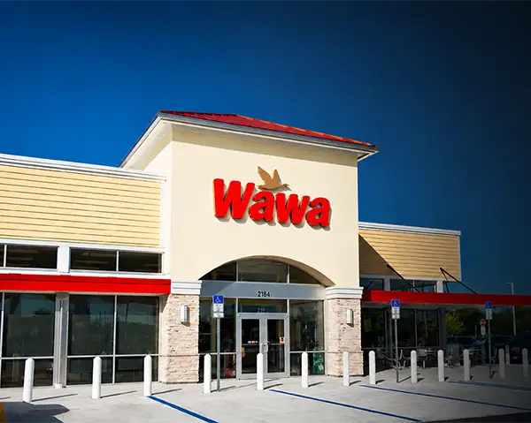 Wawa storefront with branded exterior signage as part of a multi-location signage rollout project by Thomas Sign & Awning