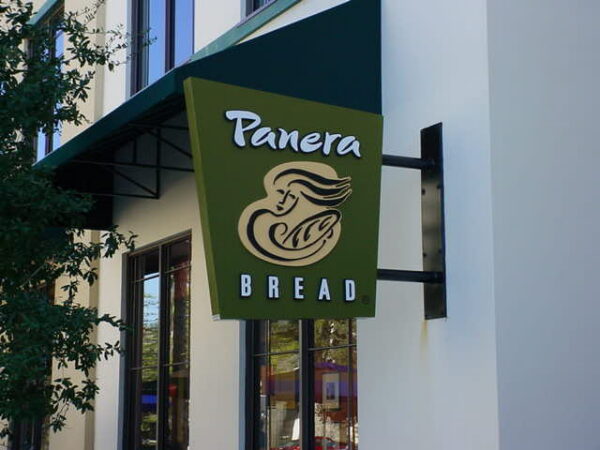 Commercial blade signs mounted perpendicular to building facade