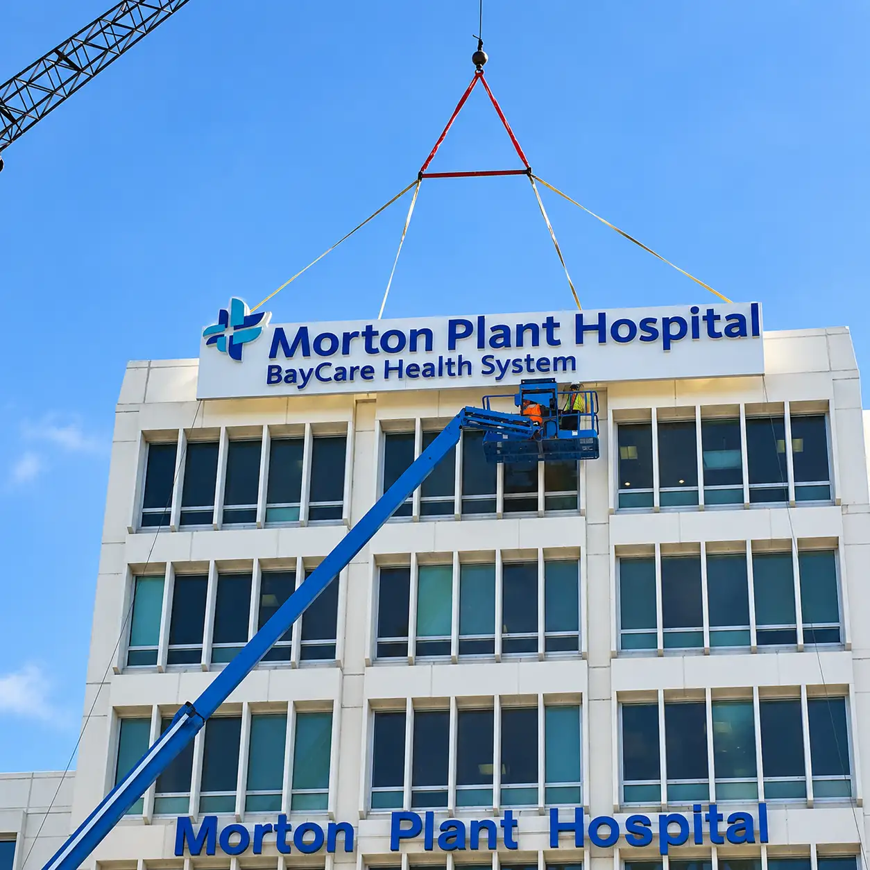 Morton Plant Hospital BayCare exterior sign installation using a crane