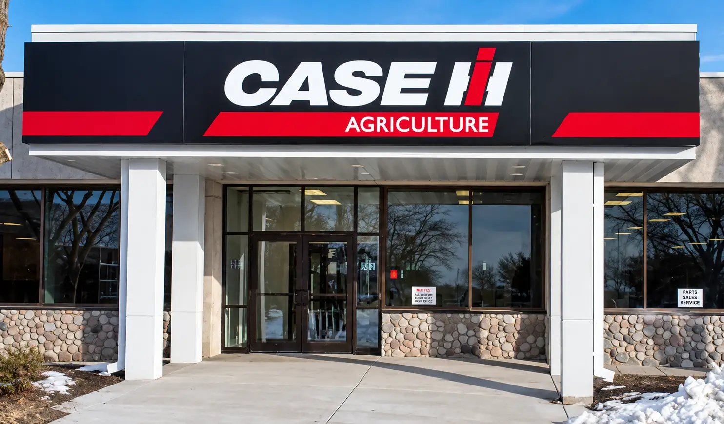Case IH exterior storefront signage installed at a dealership as part of a nationwide sign conversion program.