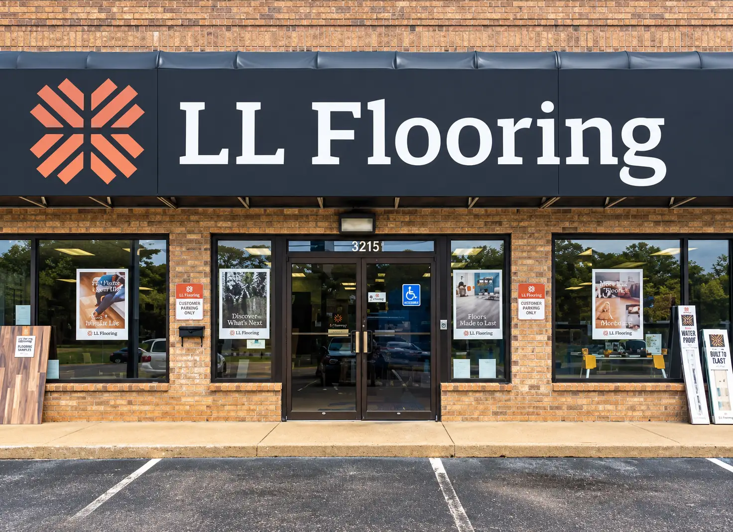 LL Flooring storefront with exterior wall sign and branded window graphics