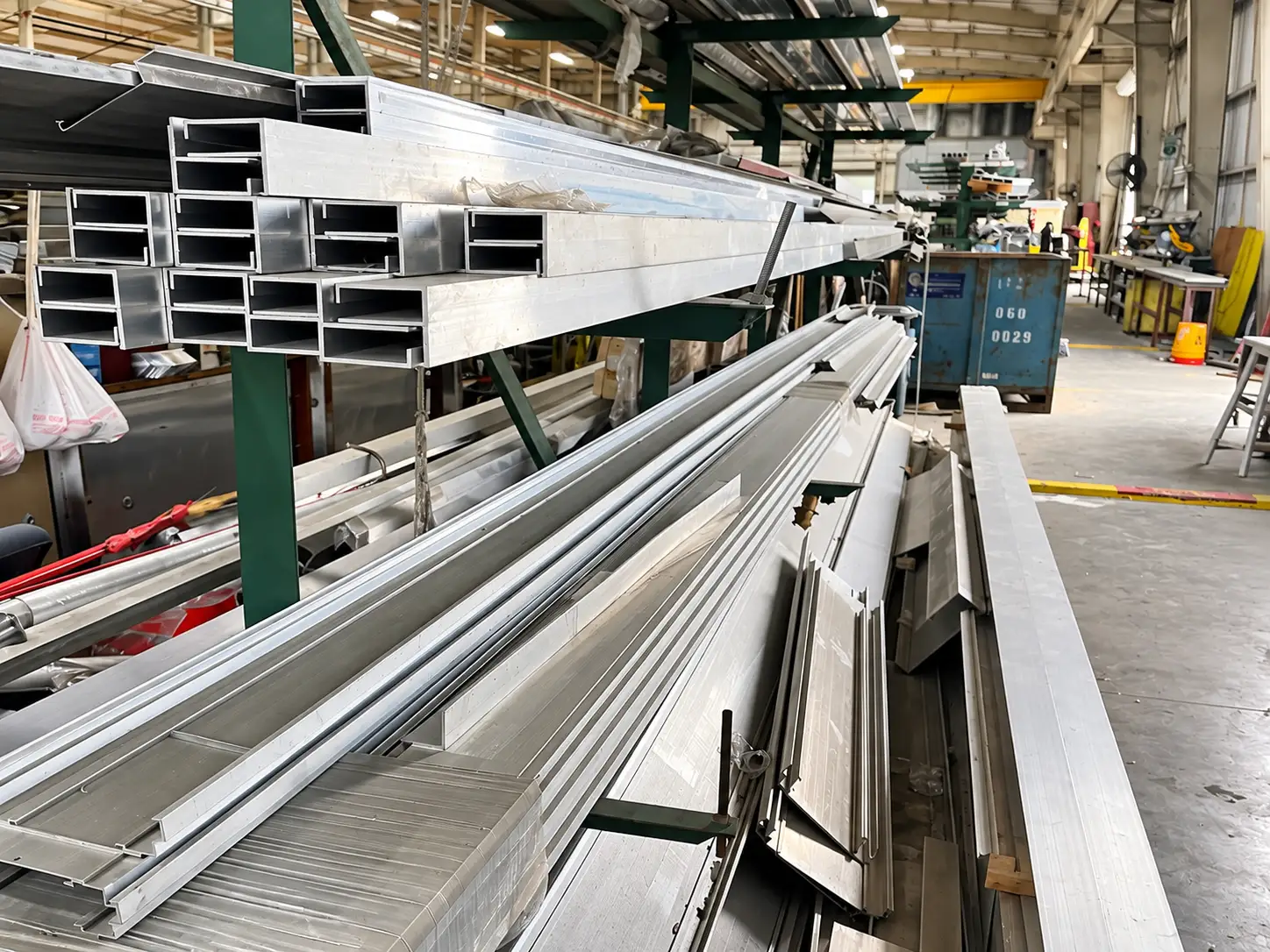 Aluminum channels and structural profiles stored for commercial sign fabrication at Thomas Sign & Awning.
