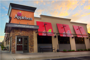Branded awning at an Applebee’s restaurant showcasing custom vinyl graphics.