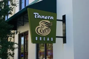 Commercial blade signs mounted perpendicular to building facade