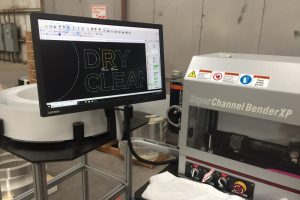Automated channel letter bending machine used in commercial sign manufacturing process
