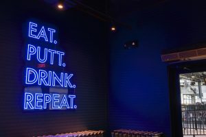 popstroke restaurant interior sign with blue LED neon lettering