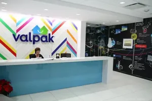Interior lobby sign with dimensional logo behind reception desk for corporate office branding