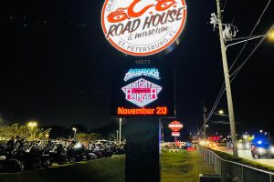 Pylon sign with electronic message center at Orange County Choppers Road House in St Petersburg Florida at night